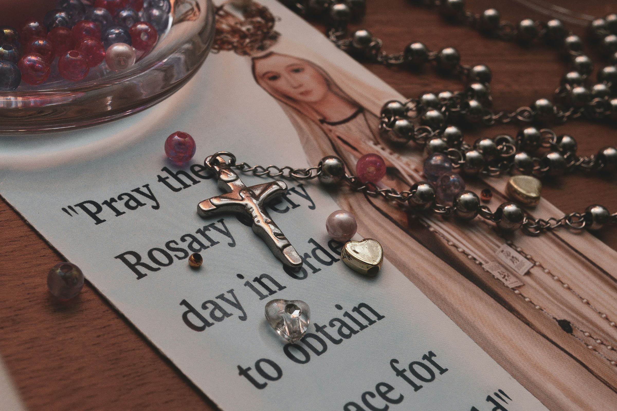 Rosary beads with Our Lady of Fatima prayer card
